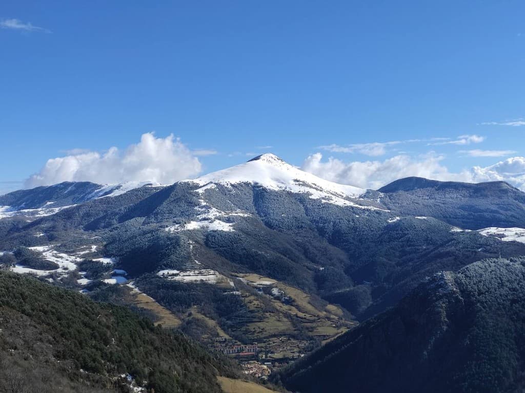 Snow-capped mountain peak above the valley