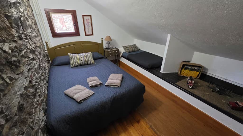 Bright double bedroom with mountain-house windows