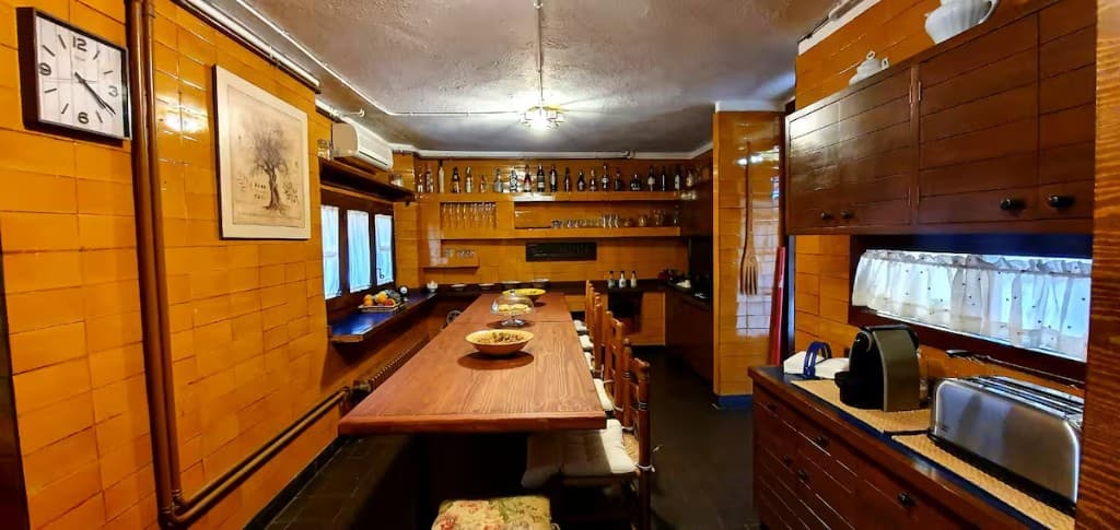 Long dining table in the kitchen for group meals