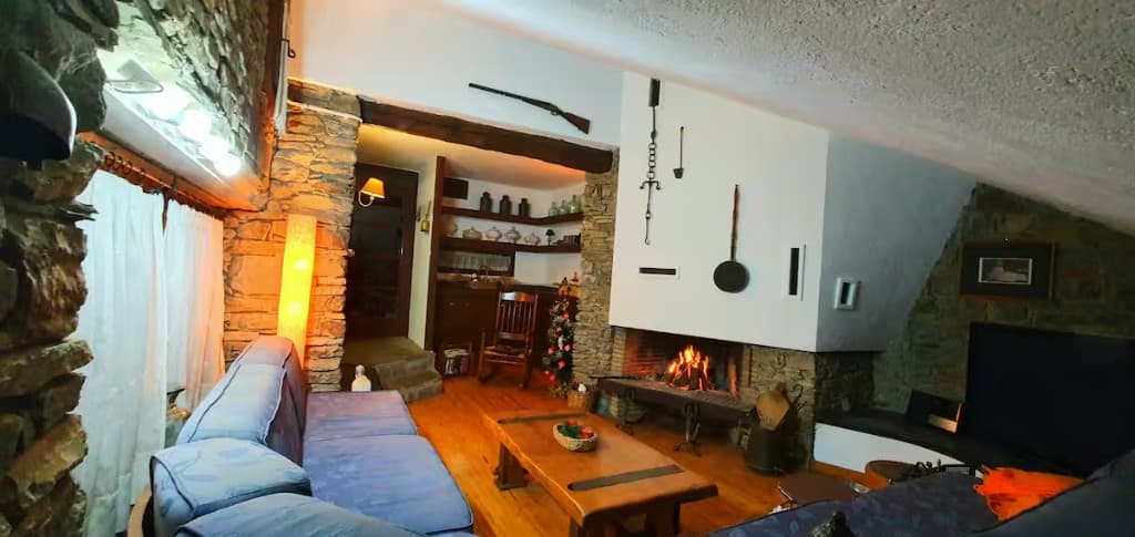 Cosy living room with lit fireplace