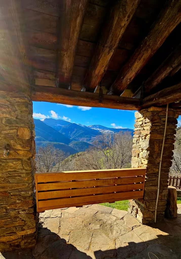 Mountain panorama framed by the stone porch